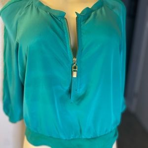 Green crop top by Jennifer Lopez